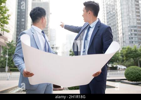 Architects discussing their work Stock Photo