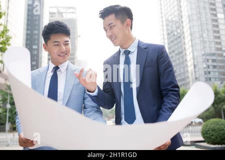 Architects discussing their work Stock Photo