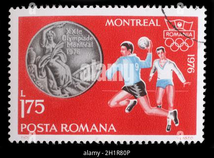 Stamp printed in Romania, shows Handball, and Olympic Rings, with inscription Montreal, 1976, circa 1976 Stock Photo
