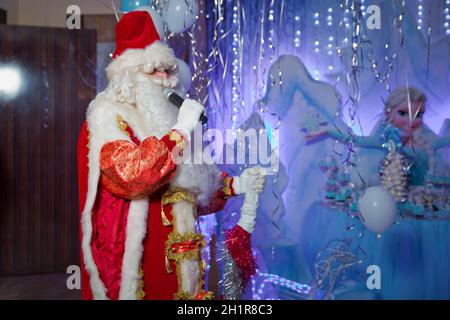 . Father Christmas , Jack Frost . Santa Claus singing Christmas songs . Father Frost singing Christmas songs Stock Photo