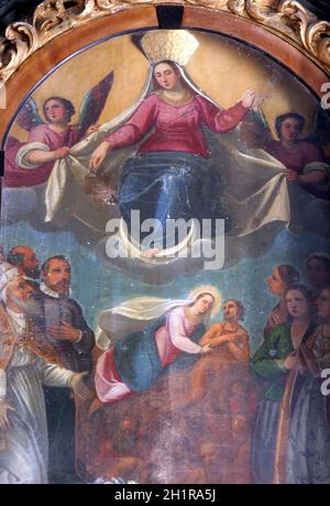 Enthroned Virgin and Child with saints and angels Stock Photo