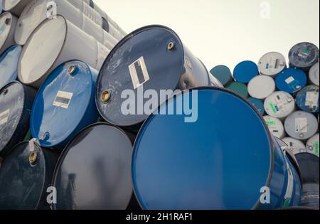 Old chemical barrels. Blue oil drum. Steel chemical tank. Toxic waste warehouse. Hazard chemical barrel. Industrial waste drum. Hazard waste storage i Stock Photo