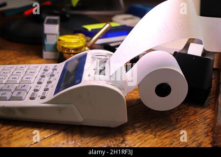 Closeup of the paper roll on a calculator adding machine. Stock Photo