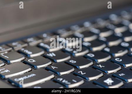 Macro shot of laptop with black keyboard. Stock Photo