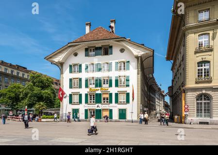 Bern, Switzerland - May 26, 2016: The famous Entrecote Cafe Federal houses in traditional Swiss building in Bundesplatz square in Bern, Switzerland. Stock Photo