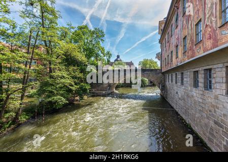 Bamberg, Germany - May 22, 2016: The wall of the old town hall and bridge in downtown of Bamberg, Upper Franconia, Bavaria, Germany. Bamberg is under Stock Photo