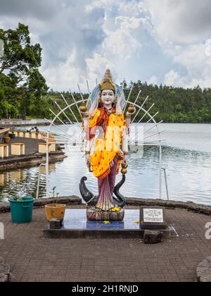 Grand Bassin, Mauritius - December 26, 2017: Statue of an indian (hindu, buddhist) divinity in a hindu temple (Grand Basin) in Mauritius. Stock Photo