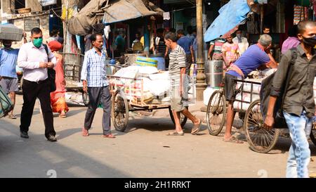 Crowded city street of Bara Bazar, a lively shopping district of Calcutta on a busy working day. Burrabazar, Kolkata West Bengal India South Asia Paci Stock Photo