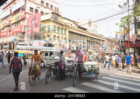 Crowded city street of Bara Bazar, a lively shopping district of Calcutta on a busy working day. Burrabazar, Kolkata West Bengal India South Asia Paci Stock Photo