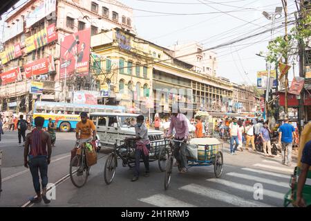 Crowded city street of Bara Bazar, a lively shopping district of Calcutta on a busy working day. Burrabazar, Kolkata West Bengal India South Asia Paci Stock Photo