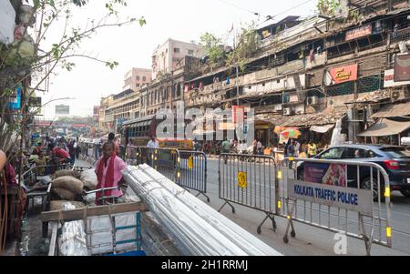 Crowded city street of Bara Bazar, a lively shopping district of Calcutta on a busy working day. Burrabazar, Kolkata West Bengal India South Asia Paci Stock Photo