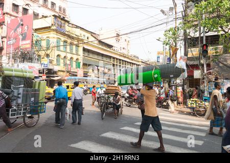 Crowded city street of Bara Bazar, a lively shopping district of Calcutta on a busy working day. Burrabazar, Kolkata West Bengal India South Asia Paci Stock Photo