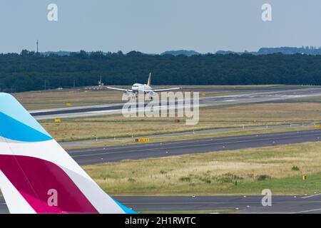 DUESSELDORF, NRW, GERMANY - JUNE 18, 2019: Eurowing plane lands at Dusseldorf International Airport Stock Photo