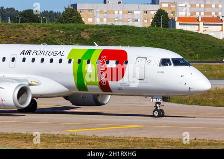 Porto, Portugal - September 21, 2021: TAP Portugal Express Embraer 190 airplane at Porto airport (OPO) in Portugal. Stock Photo