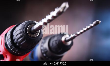 Composition with two cordless drills also working as screw guns Stock Photo