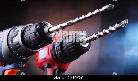 Composition with two cordless drills also working as screw guns Stock Photo