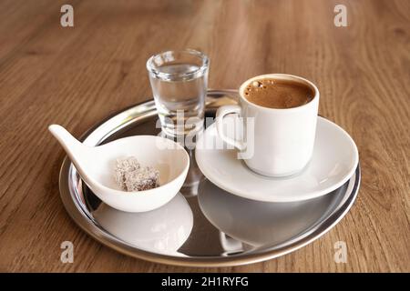 Traditional Turkish coffee with cold water and Turkish delight - Image Stock Photo