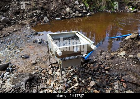 Back view of a sluce setup for extracting gold. Stock Photo
