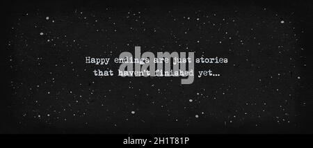 Happy endings are just stories that haven't finished yet... Powerful quote, minimalist text art illustration, dark background, typewriter font style. Stock Photo