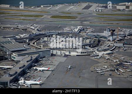 Planes and terminals at San Francisco International Airport, San Francisco, California, USA - aerial Stock Photo