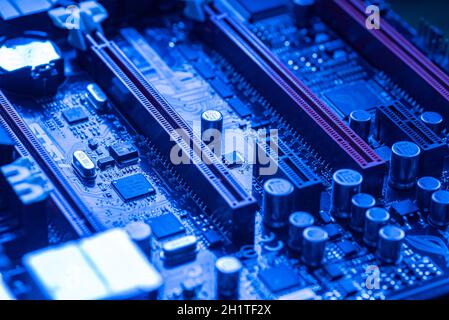 LOS ANGELES, USA 25 APRIL 2021: Pcie slot detail n a motherboard of a gaming pc in a blue light Stock Photo