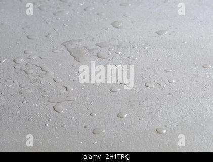 water drops on a concrete floor, microcement wet waterproof cement surface Stock Photo