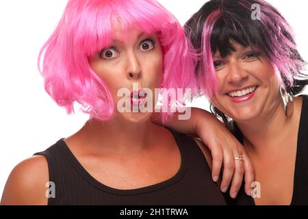 Portrait of Two Pink And Black Haired Smiling Girls Isolated on a White Background. Stock Photo