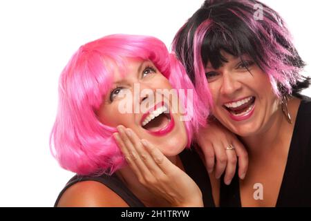 Portrait of Two Pink And Black Haired Smiling Girls Isolated on a White Background. Stock Photo