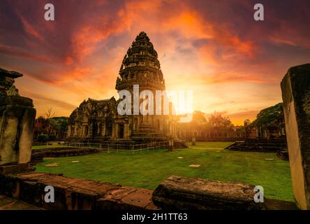 Selective focus on Phimai Historical Park with sunset sky. Landmark of Nakhon Ratchasima, Thailand. Travel destinations. Historic site is ancient. Anc Stock Photo