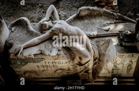 GENOA, ITALY - June 2020: antique statue of angel (1910, marble) in a Christian Catholic cemetery - Italy Stock Photo