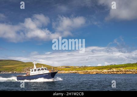 Portmagee, Ireland, August 2019 Group of tourists sailing on a boat to visit Skellig Michael island where the Star Wars were filmed, Ring of Kerry Stock Photo