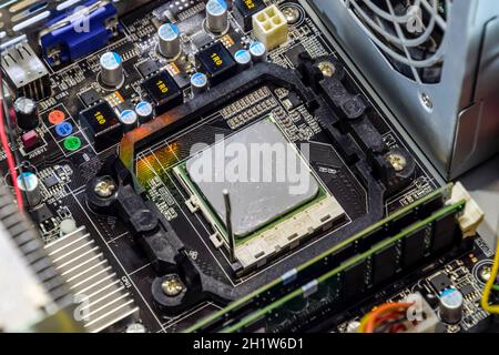 The processor of the computer with the thermal paste applied on it. Details of the computer's system unit Stock Photo