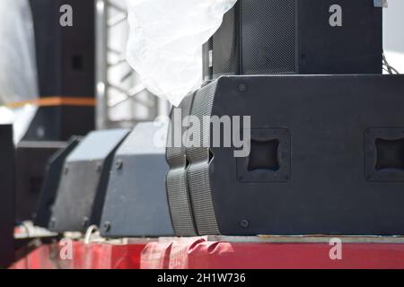Musical columns on the edge of the stage. Powerful sound equipment. Stock Photo
