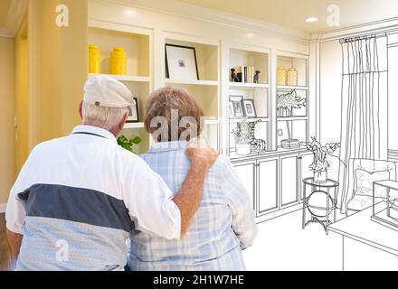 Senior Couple Facing Custom Built-in Shelves and Cabinets Design Drawing Gradating to Finished Photo. Stock Photo