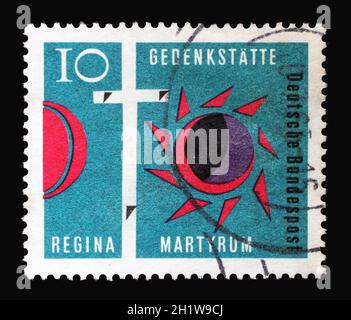 Stamp printed in Germany shows Cross of Golgotha, Darkened Sun and Moon, Consecration of Regina Martyrum Church in Berlin, circa 1963 Stock Photo