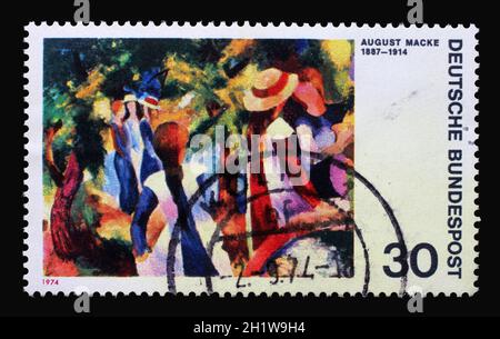 A stamp printed in Germany shows German expressionist painters: Girls Under Trees, August Macke, circa 1974 Stock Photo
