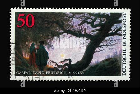 A stamp printed in Germany shows Detail of painting 'Two Men Contemplating the Moon' in MET Museum, New York U.S.A., Birth Centenary of Caspar David F Stock Photo