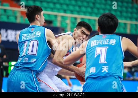 Qingdao(Shandong. 20th July, 2020. Ren Junwei (L) of Shanxi Loongs is  defended by Yang Jinmeng of Qingdao Eagles during a match between Shanxi  Loongs and Qingdao Eagles at the 2019-2020 Chinese Basketball