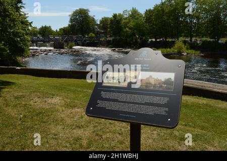SMITHS FALLS, ONTARIO, CA, JUNE 12, 2021: Historic site of the Woods Mill on the Rideau Canal located in Smiths Falls, On showing the falls of the can Stock Photo