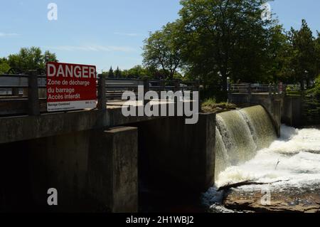 SMITHS FALLS, ONTARIO, CA, JUNE 12, 2021: The reservoir dam located on the Rideau Canal in Smiths Falls, Ontario showing its flowing currents of water Stock Photo