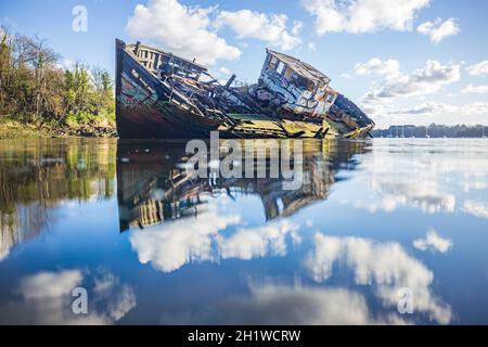 Wooden wreck boat sinking in the clouds Stock Photo