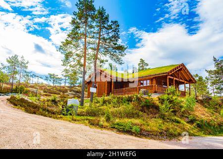 Norwegian wooden cabins cottages in the nature and mountain landscape of Treungen in Nissedal Norway. Stock Photo