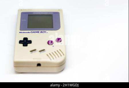 Rome, Italy, December 23, 2020: The Gameboy portable video game console from Nintendo isolated on a white background. Vintage video game console from Stock Photo