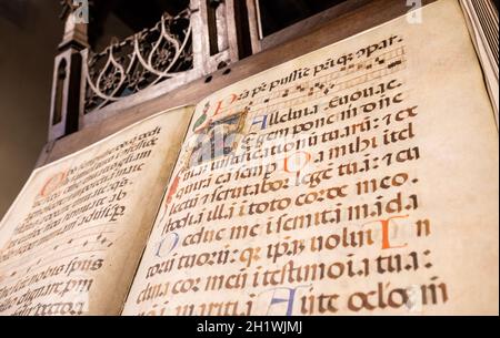 TURIN, ITALY - CIRCA MAY 2021: antique Medieval manuscript with ancient calligraphy. Stock Photo