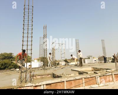 pouring concrete slab - concrete pouring during commercial concreting floors of buildings in construction Stock Photo