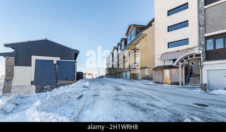 Saint Lary Soulan, France - December 26, 2020: mountain chalet in a snowy ski resort on a winter evening during the holiday season Stock Photo