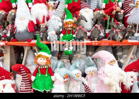 Santa Elf Store Christmas elves and santas on display at a uk store Stock Photo - Alamy