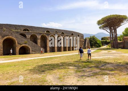 Pompeii, Naples, Italy - June 26, 2021: View on Amphitheatre of Pompeii  buried by the eruption of Vesuvius volcano in 79 AD. It is the oldest survivi Stock Photo