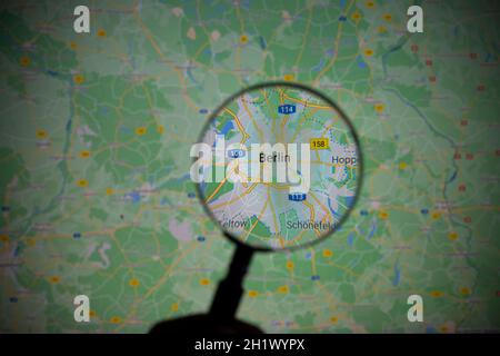 view of the city of Berlin, capital of Germany, through a magnifying glass on Google Maps Stock Photo