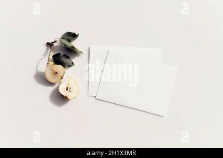 Mockup of white sheets of paper with hard shadows from the sun on a summer day. Stationery. Flat lay Stock Photo